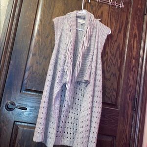 A knitted gray cardigan.